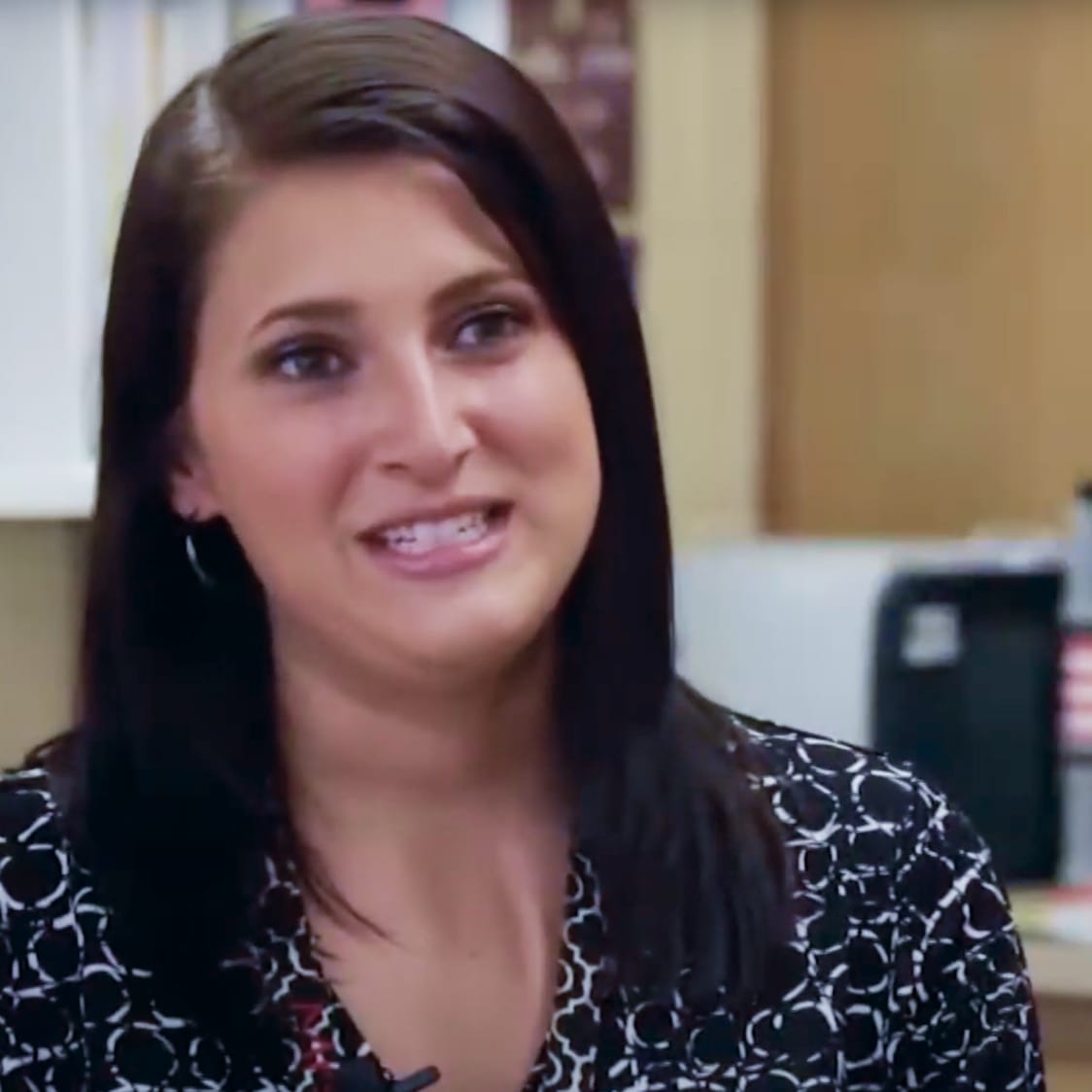 Photo of a teacher talking to camera